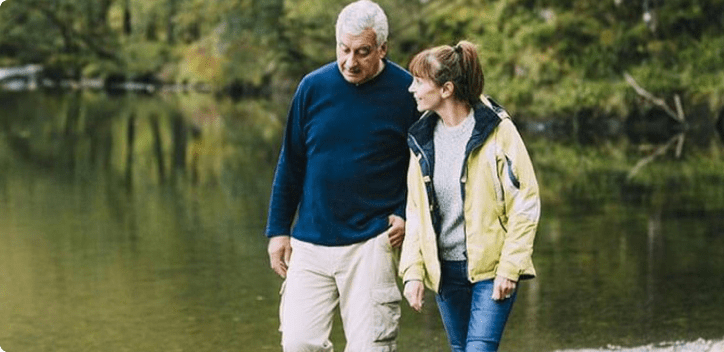 Couple walking by lake Couple walking by lake