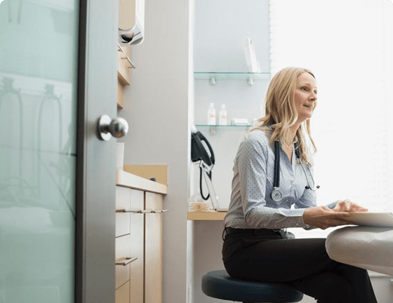 Doctor in clinic looking in front of her Doctor in clinic looking in front of her