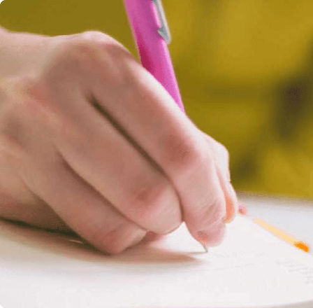 Hand writing with a pink pen Hand writing with a pink pen