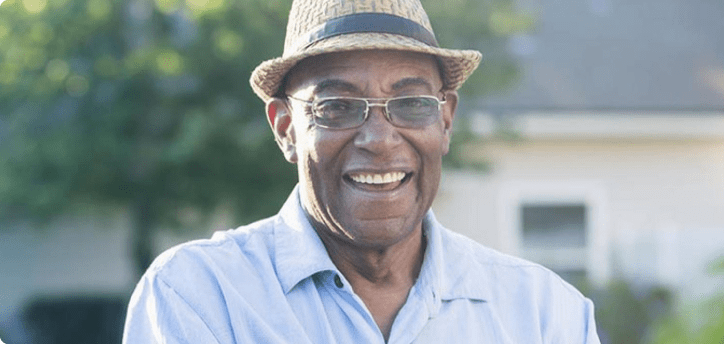 Smiling man standing in a garden Smiling man standing in a garden