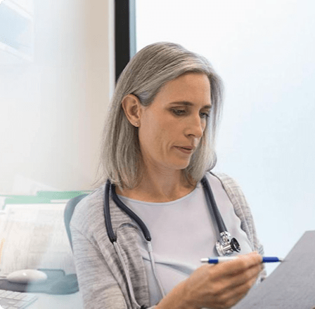 Woman checking medical charts Woman checking medical charts