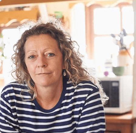 Woman staring at camera with stripey top Woman staring at camera with stripey top