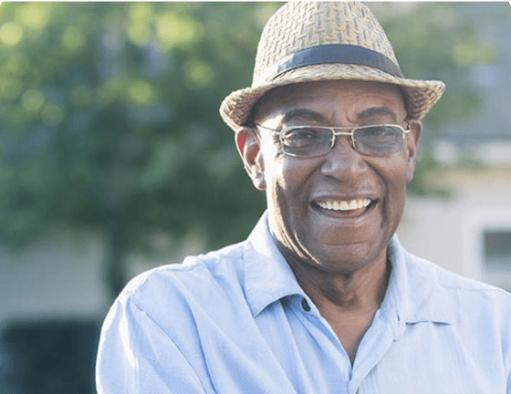 Smiling man standing in a garden Smiling man standing in a garden